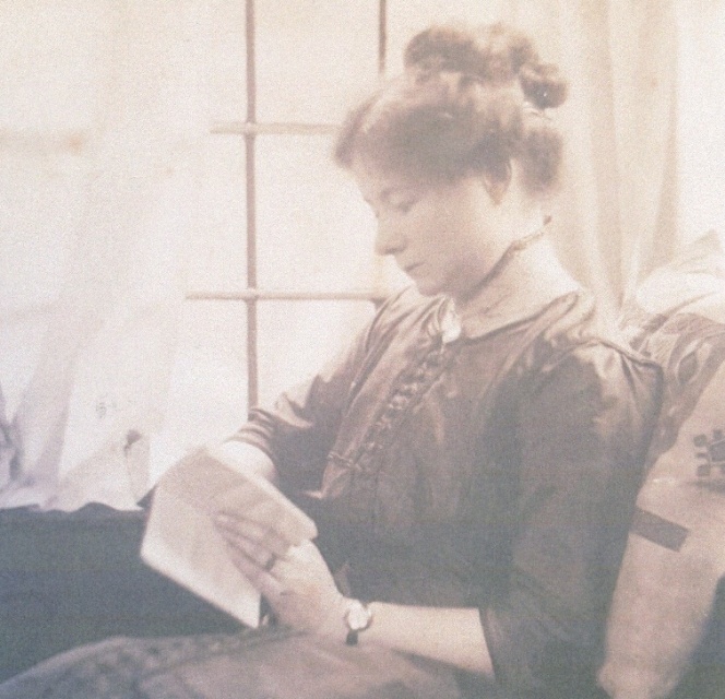 A person sitting on a couch reading a book AI-generated content may be incorrect.
